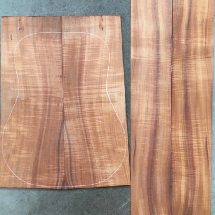 Koa OM/Dreadnought 4A $550
(2) back plates 8-5/8" x 22-1/2" (tapers to 7-1/2")
(2) side plates 5-1/4" x 32-7/8"
Air dried since 2018, 16" dred pattern shown, strong curl, vertical grain, bright orange-brown.
set #212-2228