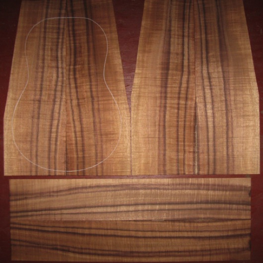 Koa Tenor Ukulele AAA $155
(4) top-back plates 5" x 14" (tapering to 3-5/8"
)(2) side plates 3-1/4" x 18-7/8"
Air dried since 2016, tenor pattern shown, rich colors, dark stripes, strong flame.
set #181-1660 Koa Tenor Ukulele AAA $155
(4) top-back plates 5" x 14" (tapering to 3-5/8"
)(2) side plates 3-1/4" x 18-7/8"
Air dried since 2016, tenor pattern shown, rich colors, dark stripes, strong flame.
set #181-1660