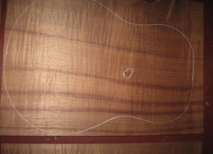 closeup, shown dry
set #200-2470
Tight knot which can be placed in soundhole cutout as seen above. All plates sanded to .090" with 100-grit. Discounted due to cupping on top/back plates; this will be no problem when 
braced--guaranteed.  